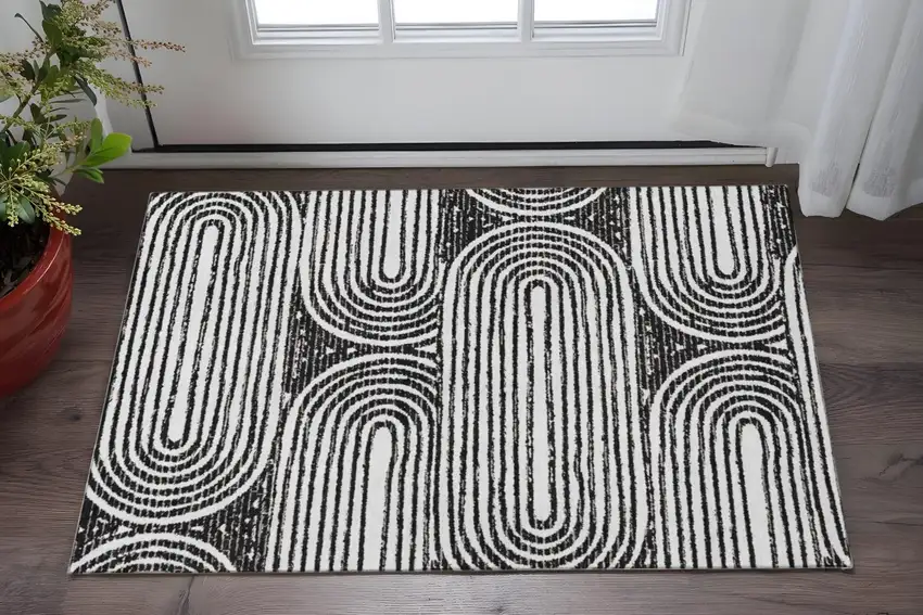Black And Ivory Geometric Washable Area Rug With UV Protection Photo 2