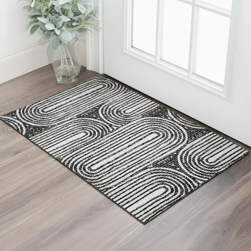 Black And Ivory Geometric Washable Area Rug With UV Protection Photo 1