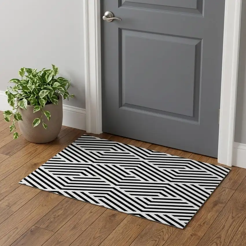 Black And Ivory Geometric Washable Area Rug With UV Protection Photo 1