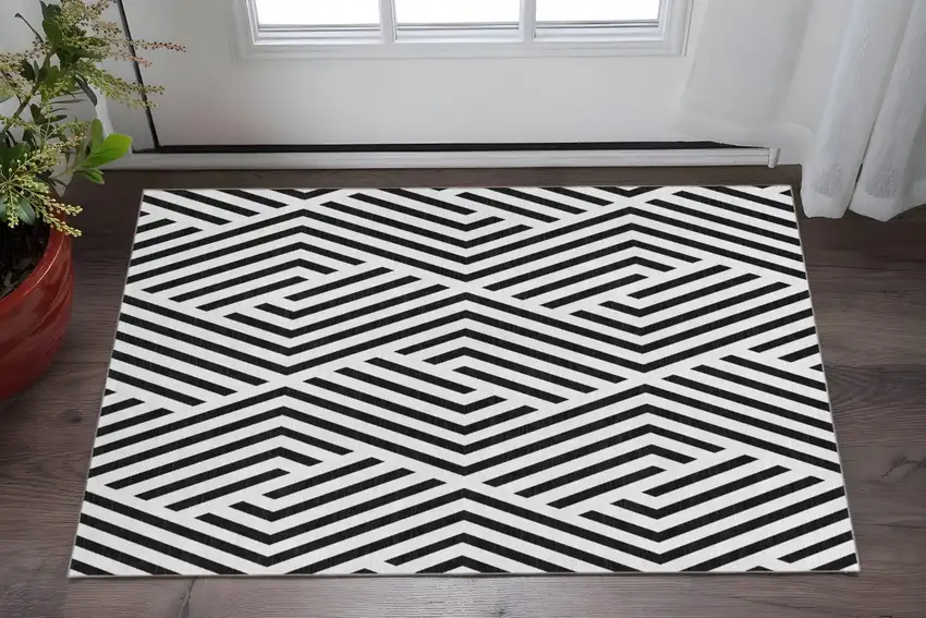 Black And Ivory Geometric Washable Area Rug With UV Protection Photo 2
