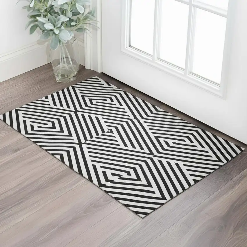 Black And Ivory Geometric Washable Area Rug With UV Protection Photo 1