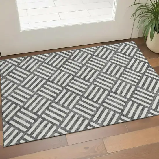 Black And Ivory Geometric Washable Area Rug With UV Protection Photo 1