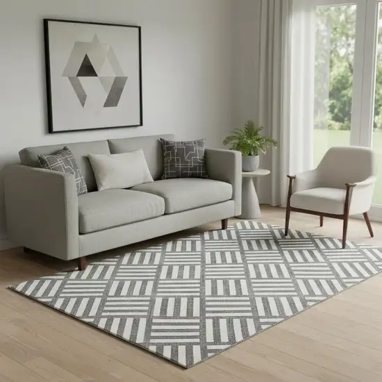 Black And Ivory Geometric Washable Area Rug With UV Protection Photo 1