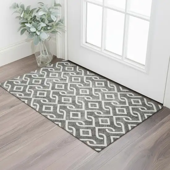 Black And Ivory Geometric Washable Area Rug With UV Protection Photo 1
