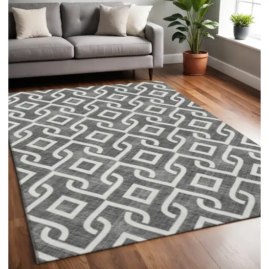 Black And Ivory Geometric Washable Area Rug With UV Protection Photo 2