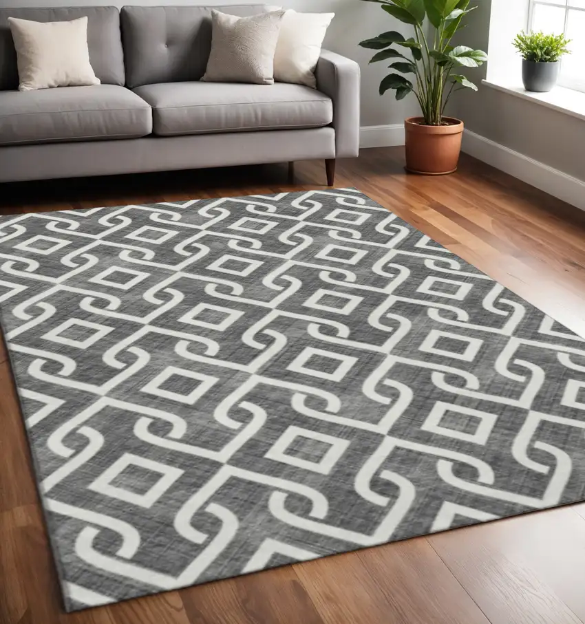 Black And Ivory Geometric Washable Area Rug With UV Protection Photo 2