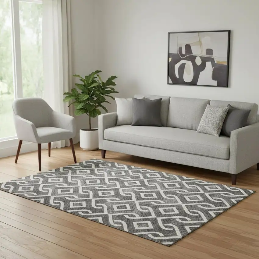 Black And Ivory Geometric Washable Area Rug With UV Protection Photo 1