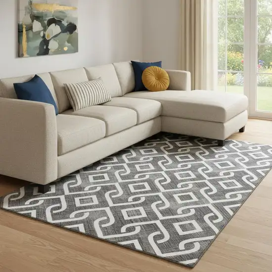 Black And Ivory Geometric Washable Area Rug With UV Protection Photo 1