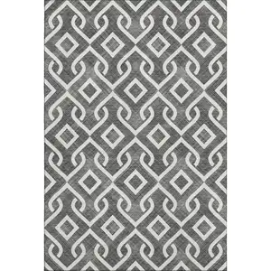 Photo of Black And Ivory Geometric Washable Area Rug With UV Protection