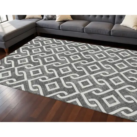 Black And Ivory Geometric Washable Area Rug With UV Protection Photo 2