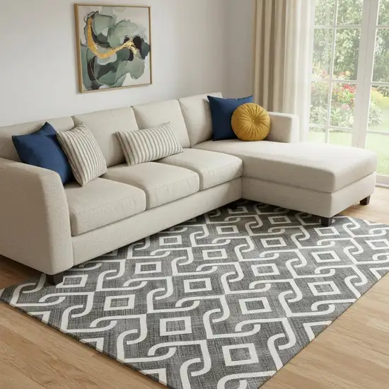 Black And Ivory Geometric Washable Area Rug With UV Protection Photo 1