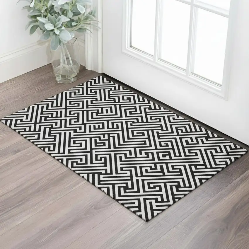 Black And Ivory Geometric Washable Area Rug With UV Protection Photo 1