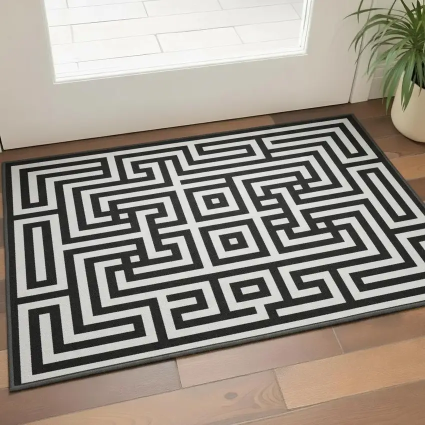 Black And Ivory Geometric Washable Area Rug With UV Protection Photo 2