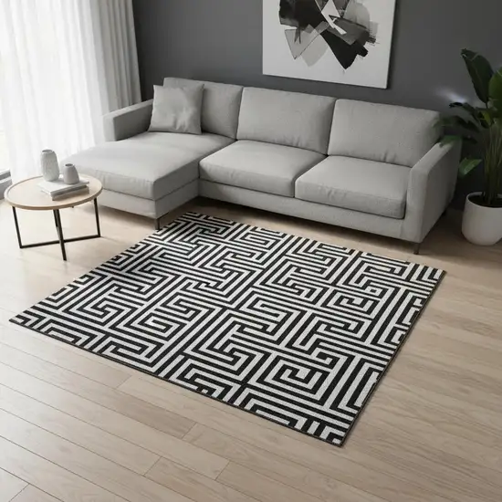 Black And Ivory Geometric Washable Area Rug With UV Protection Photo 2