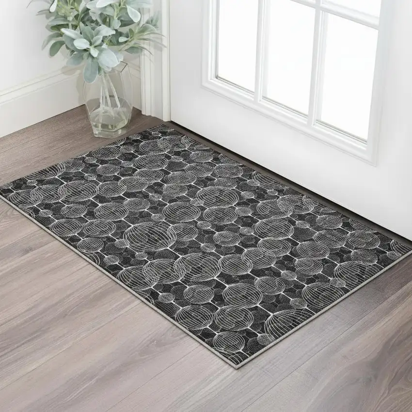 Black And Ivory Geometric Washable Area Rug With UV Protection Photo 2