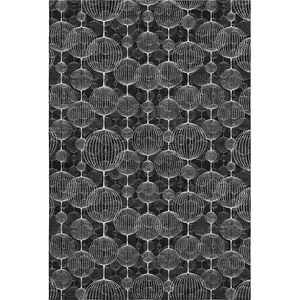 Photo of Black And Ivory Geometric Washable Area Rug With UV Protection