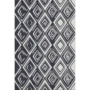 Photo of Black And Ivory Geometric Washable Area Rug With UV Protection