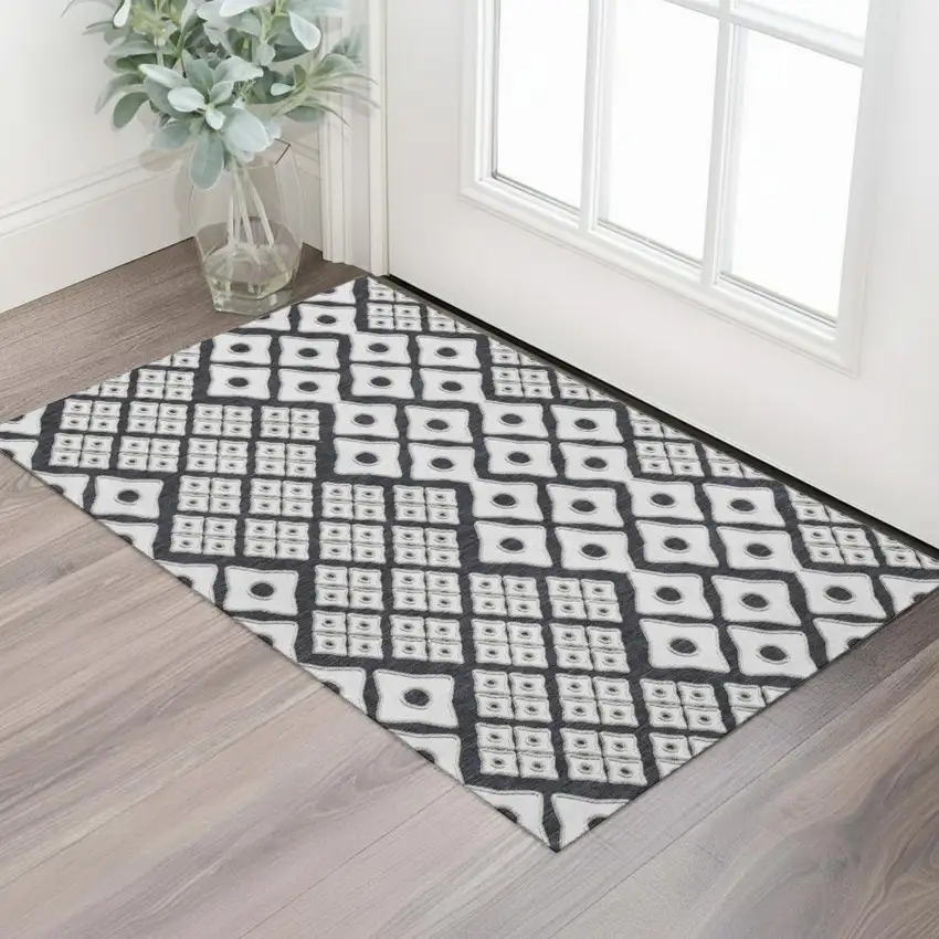 Black And Ivory Geometric Washable Area Rug With UV Protection Photo 1