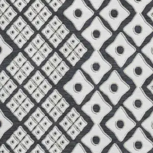 Photo of Black And Ivory Geometric Washable Area Rug With UV Protection
