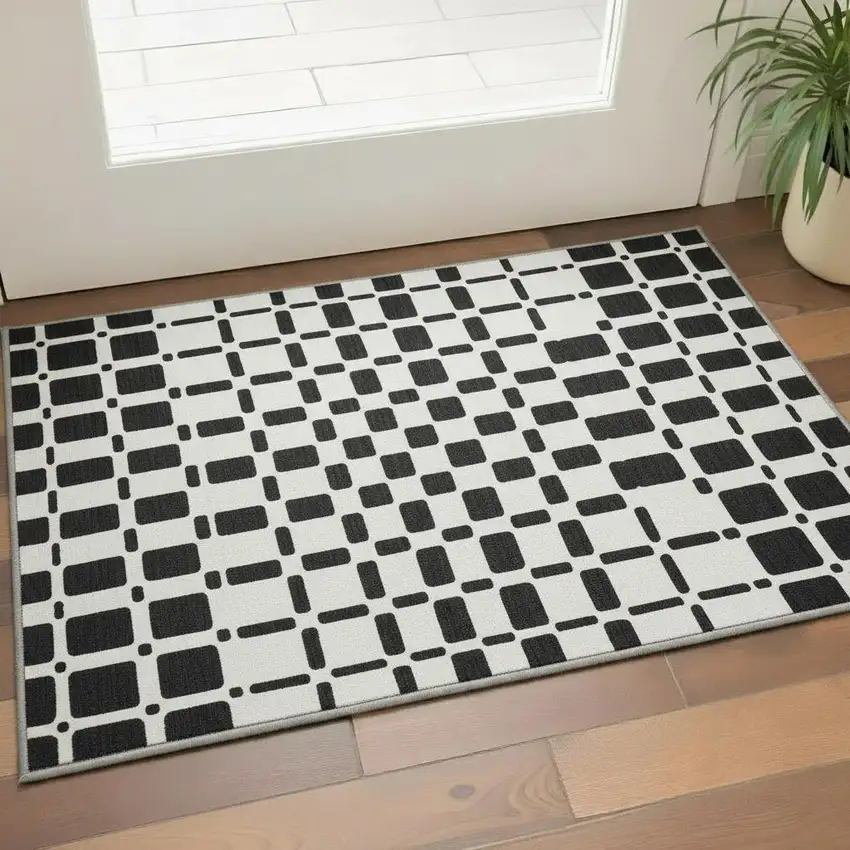 Black And Ivory Geometric Washable Area Rug With UV Protection Photo 2
