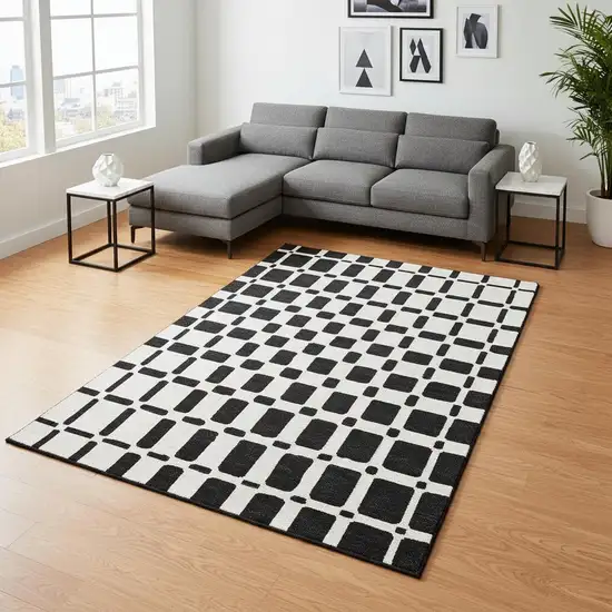 Black And Ivory Geometric Washable Area Rug With UV Protection Photo 2