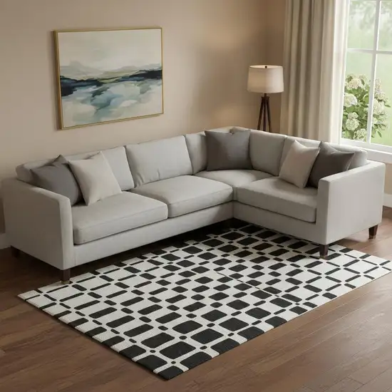 Black And Ivory Geometric Washable Area Rug With UV Protection Photo 1