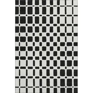 Photo of Black And Ivory Geometric Washable Area Rug With UV Protection