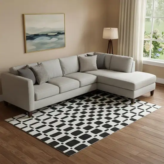 Black And Ivory Geometric Washable Area Rug With UV Protection Photo 1