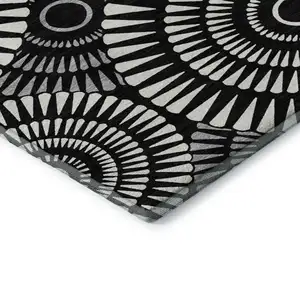 Photo of Black And Ivory Geometric Washable Area Rug With UV Protection
