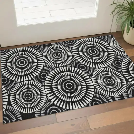 Black And Ivory Geometric Washable Area Rug With UV Protection Photo 1