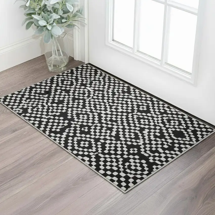 Black And Ivory Geometric Washable Area Rug With UV Protection Photo 2