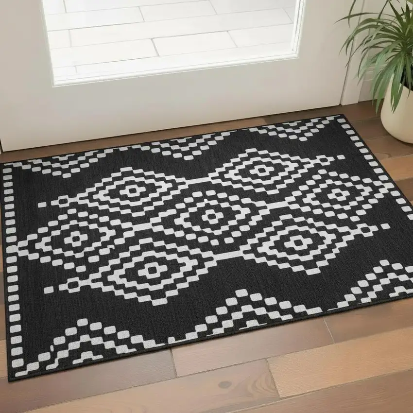 Black And Ivory Geometric Washable Area Rug With UV Protection Photo 1