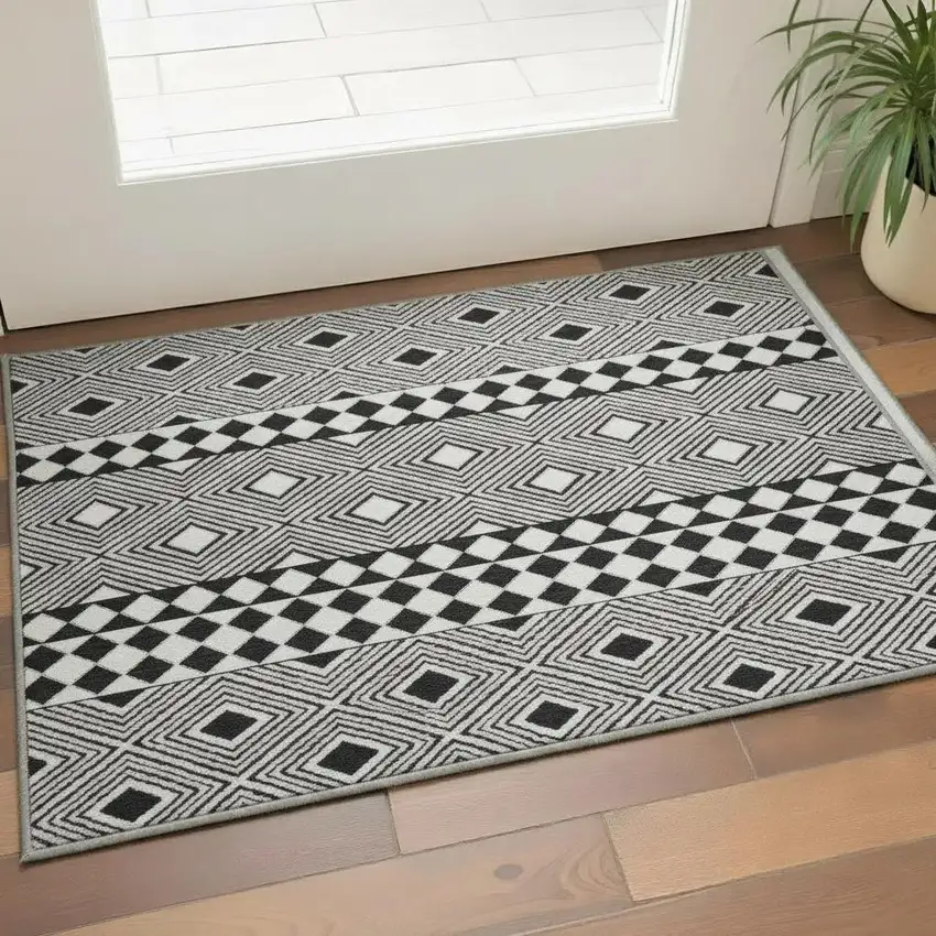 Black And Ivory Geometric Washable Area Rug With UV Protection Photo 2