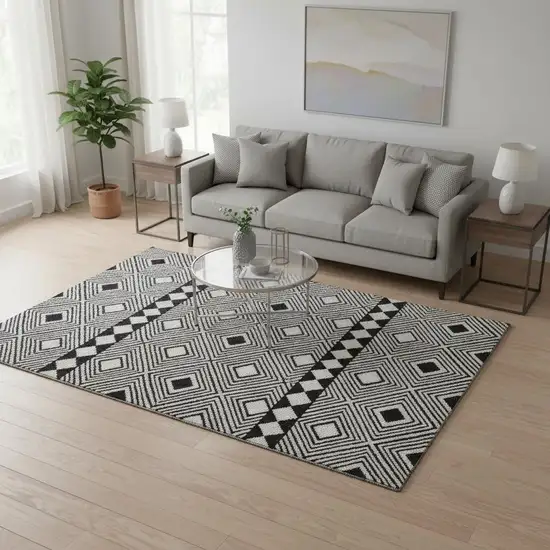 Black And Ivory Geometric Washable Area Rug With UV Protection Photo 2