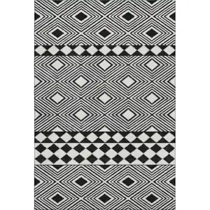 Photo of Black And Ivory Geometric Washable Area Rug With UV Protection