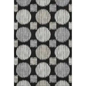 Photo of Black And Ivory Geometric Washable Area Rug With UV Protection