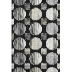 Photo of Black And Ivory Geometric Washable Area Rug With UV Protection