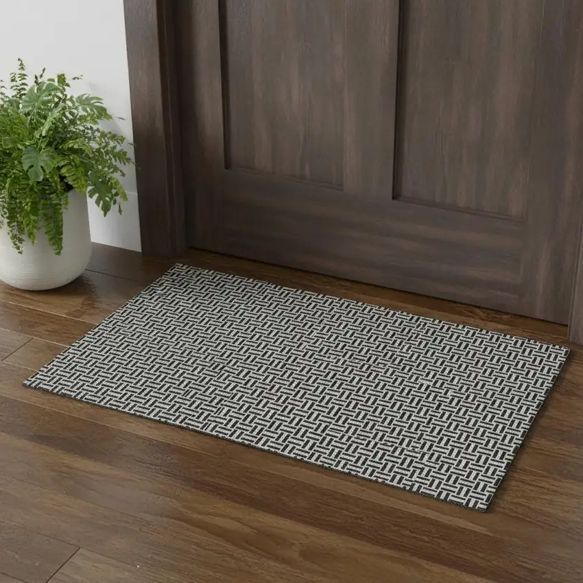 Black And Ivory Geometric Washable Area Rug With UV Protection Photo 1