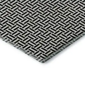 Photo of Black And Ivory Geometric Washable Area Rug With UV Protection