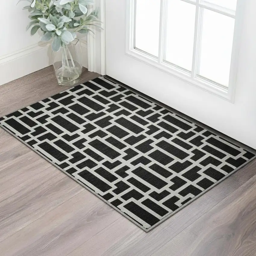 Black And Ivory Geometric Washable Area Rug With UV Protection Photo 2