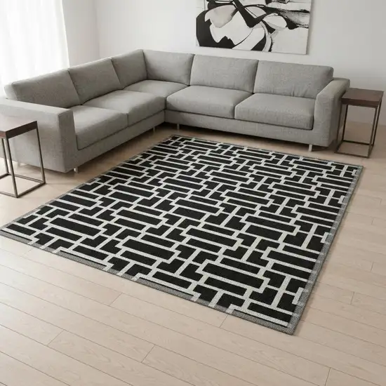 Black And Ivory Geometric Washable Area Rug With UV Protection Photo 2
