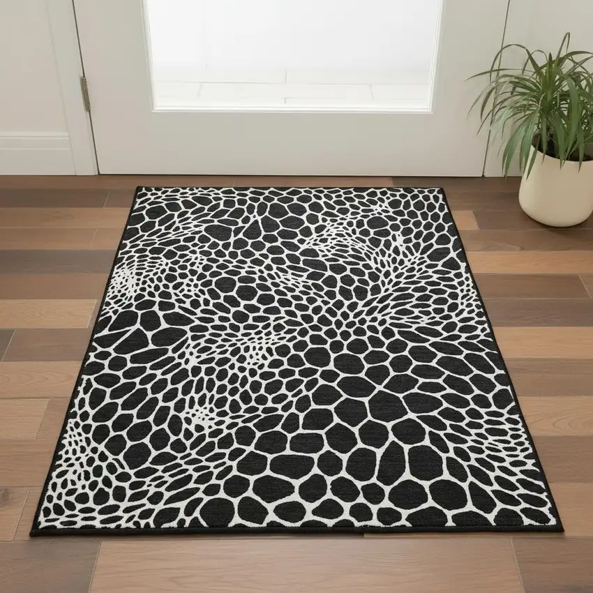Black And Ivory Geometric Washable Area Rug With UV Protection Photo 2