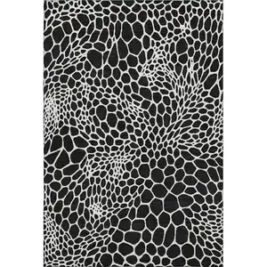 Photo of Black And Ivory Geometric Washable Area Rug With UV Protection