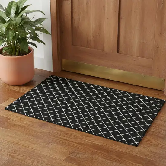 Black And Ivory Geometric Washable Area Rug With UV Protection Photo 2