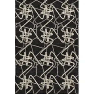 Photo of Black And Ivory Geometric Washable Area Rug With UV Protection