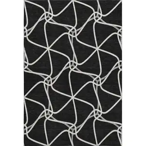 Photo of Black And Ivory Geometric Washable Area Rug With UV Protection