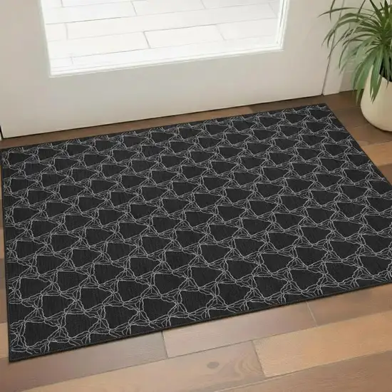 Black And Ivory Geometric Washable Area Rug With UV Protection Photo 2