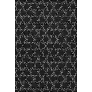 Photo of Black And Ivory Geometric Washable Area Rug With UV Protection