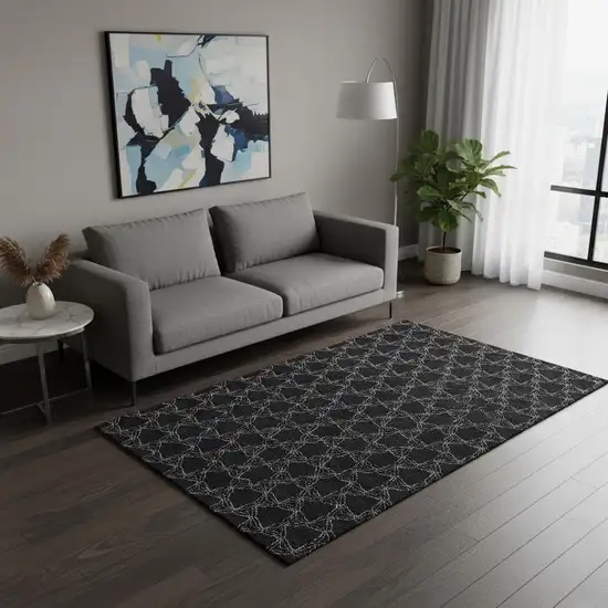 Black And Ivory Geometric Washable Area Rug With UV Protection Photo 2