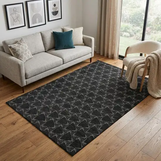 Black And Ivory Geometric Washable Area Rug With UV Protection Photo 1